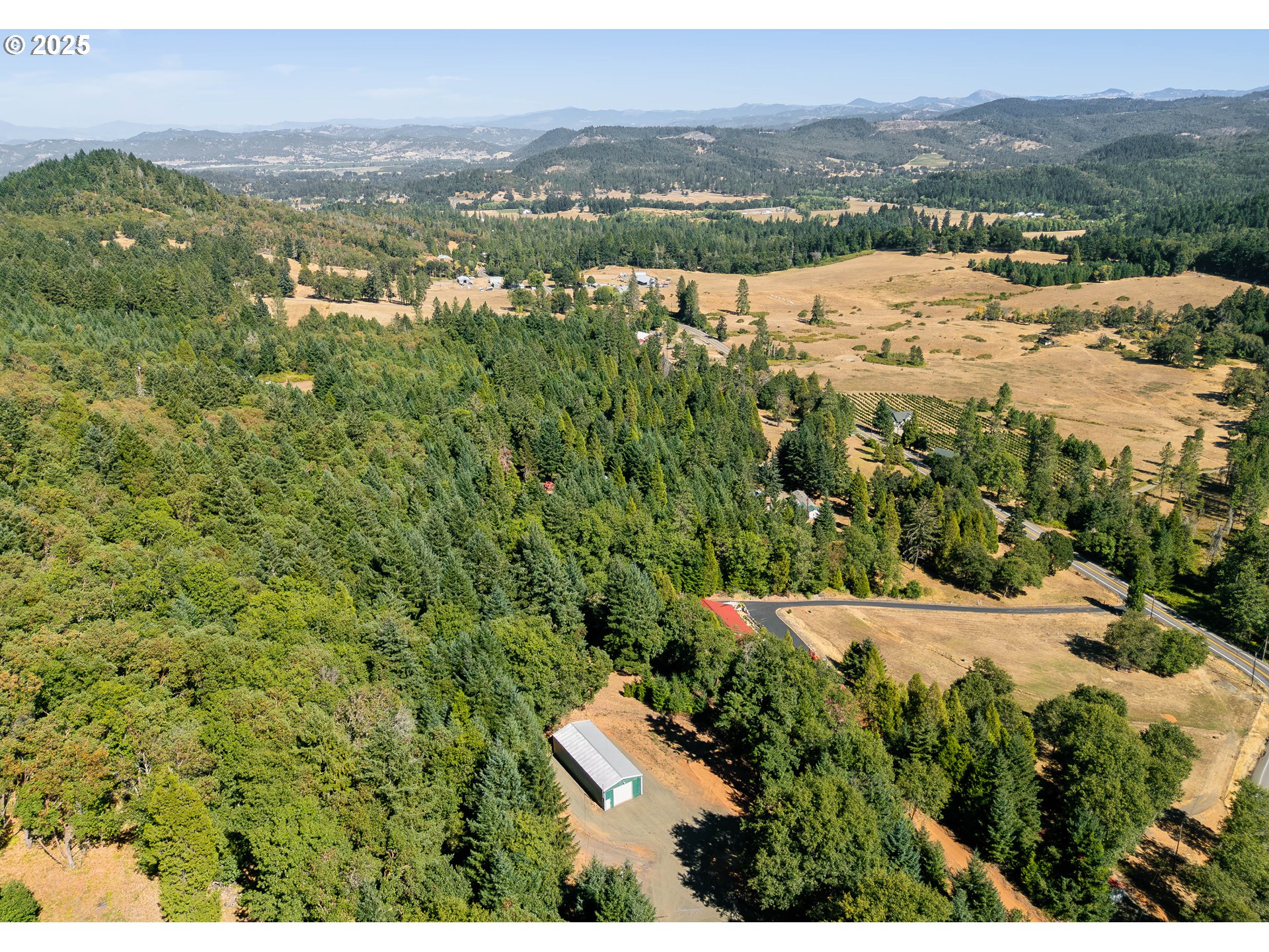 281 Callahan Road Roseburg, OR 97471 - Photo 4 of 39 a view of a lake with mountains in the background