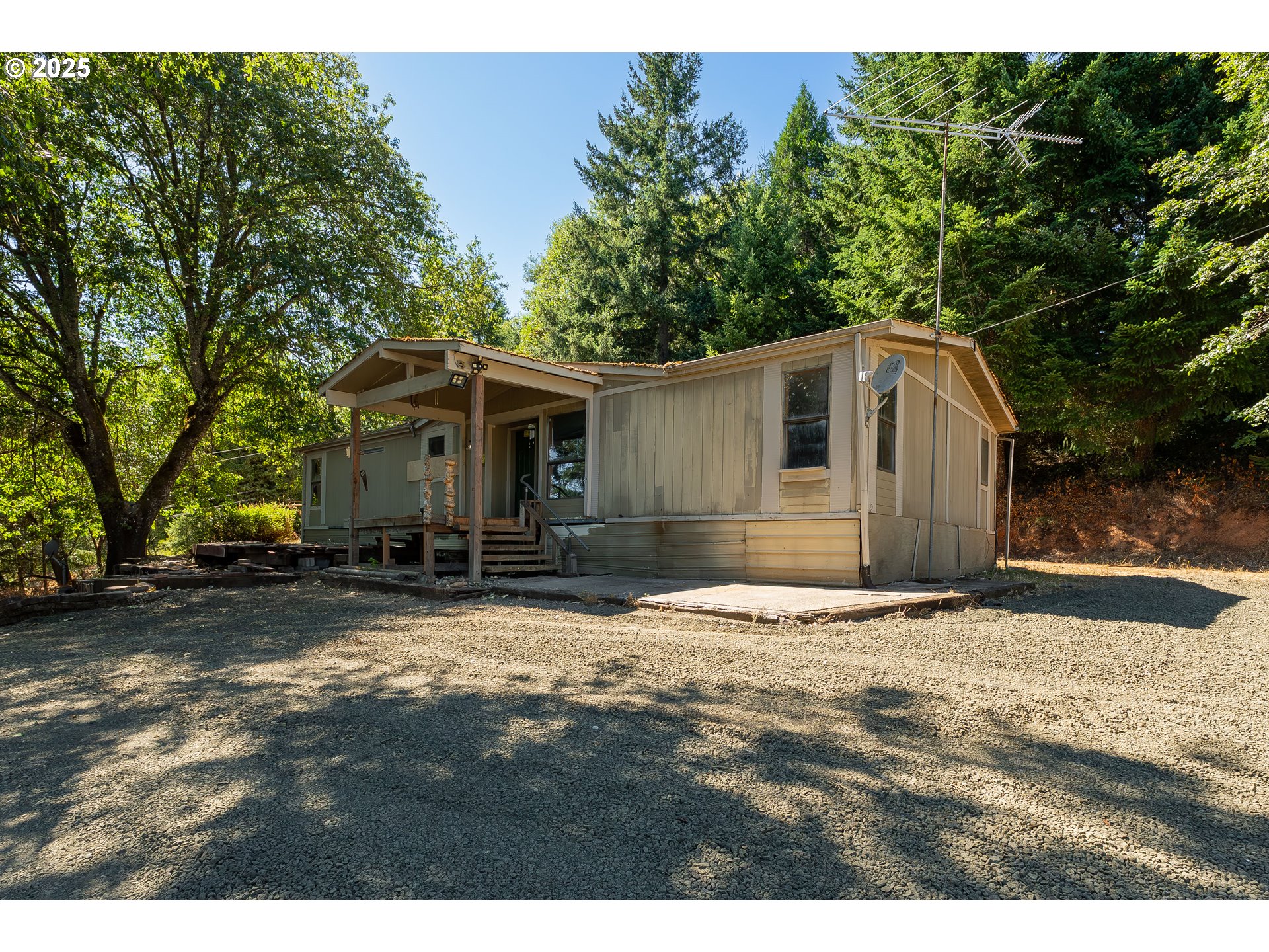 281 Callahan Road Roseburg, OR 97471 - Photo 7 of 39 a view of a yard in front of a house with large trees