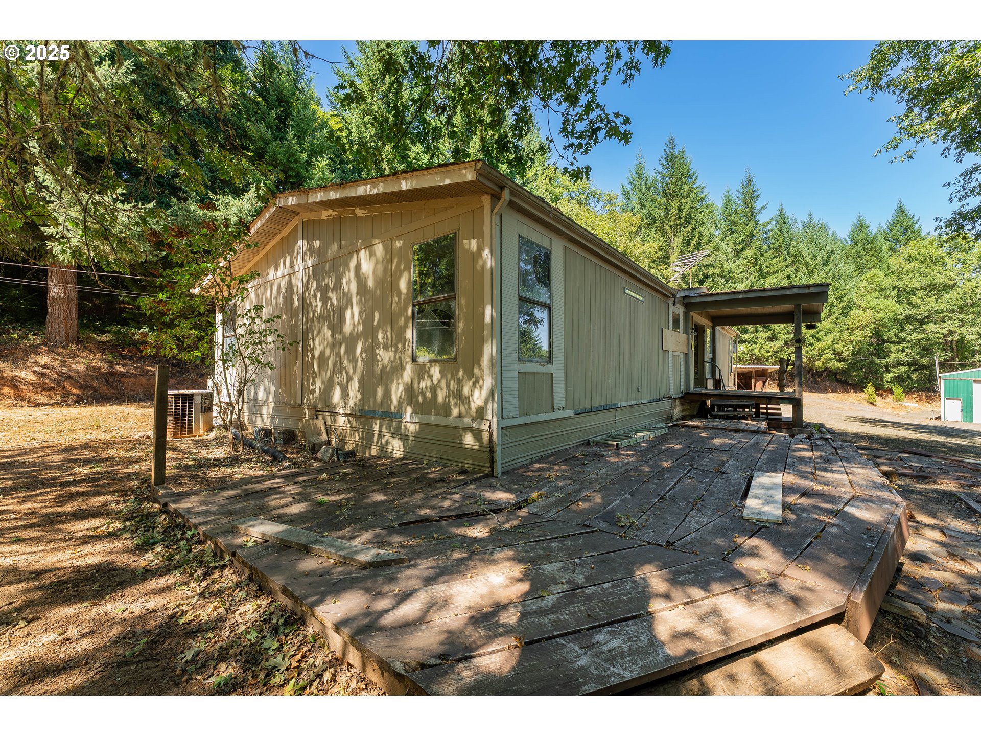 281 Callahan Road Roseburg, OR 97471 - Photo 9 of 39 a backyard of a house with barbeque oven table and chairs
