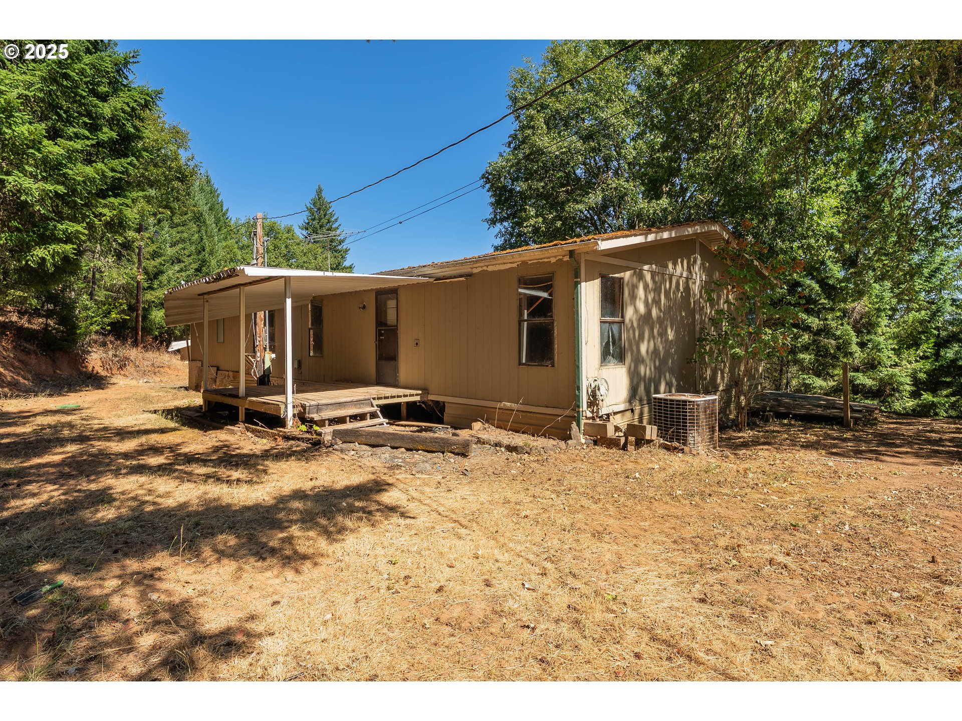 281 Callahan Road Roseburg, OR 97471 - Photo 10 of 39 a view of a house with a patio
