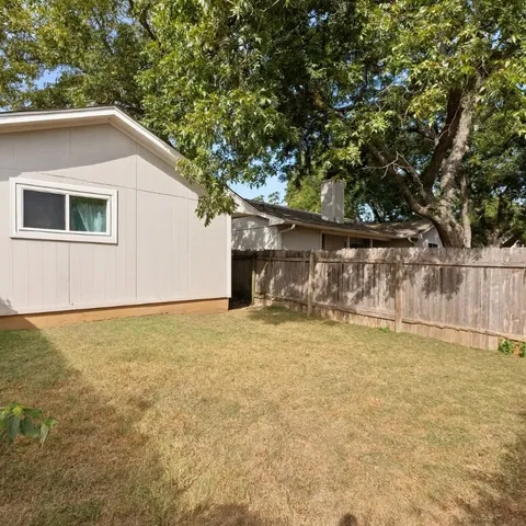 a house with trees in the background