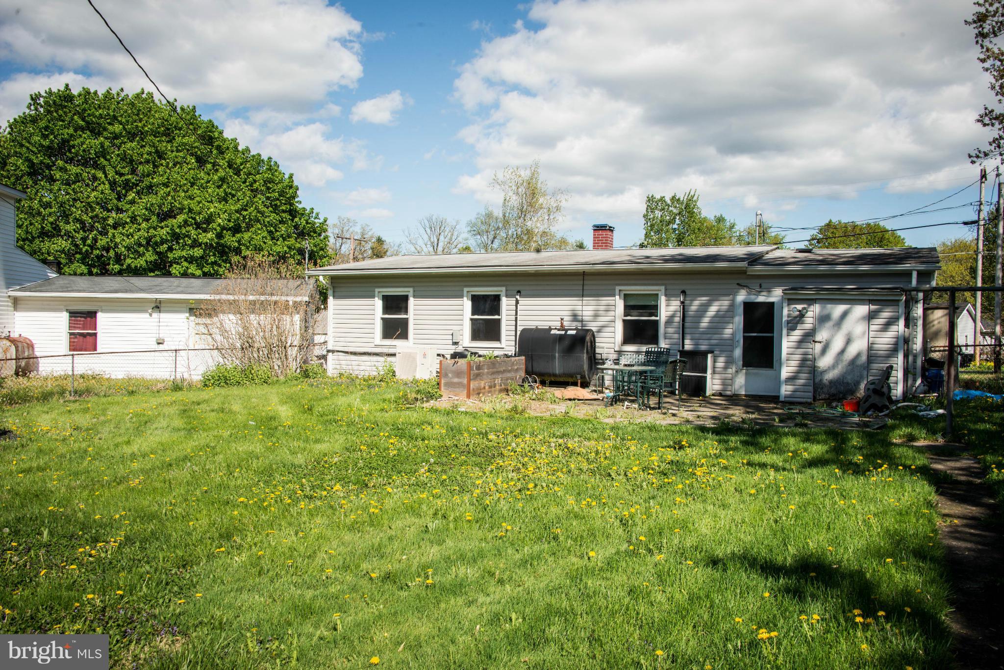 9306 Bethel Road Frederick, MD 21702 - Photo 2 of 19 a view of a house with backyard sitting area and garden