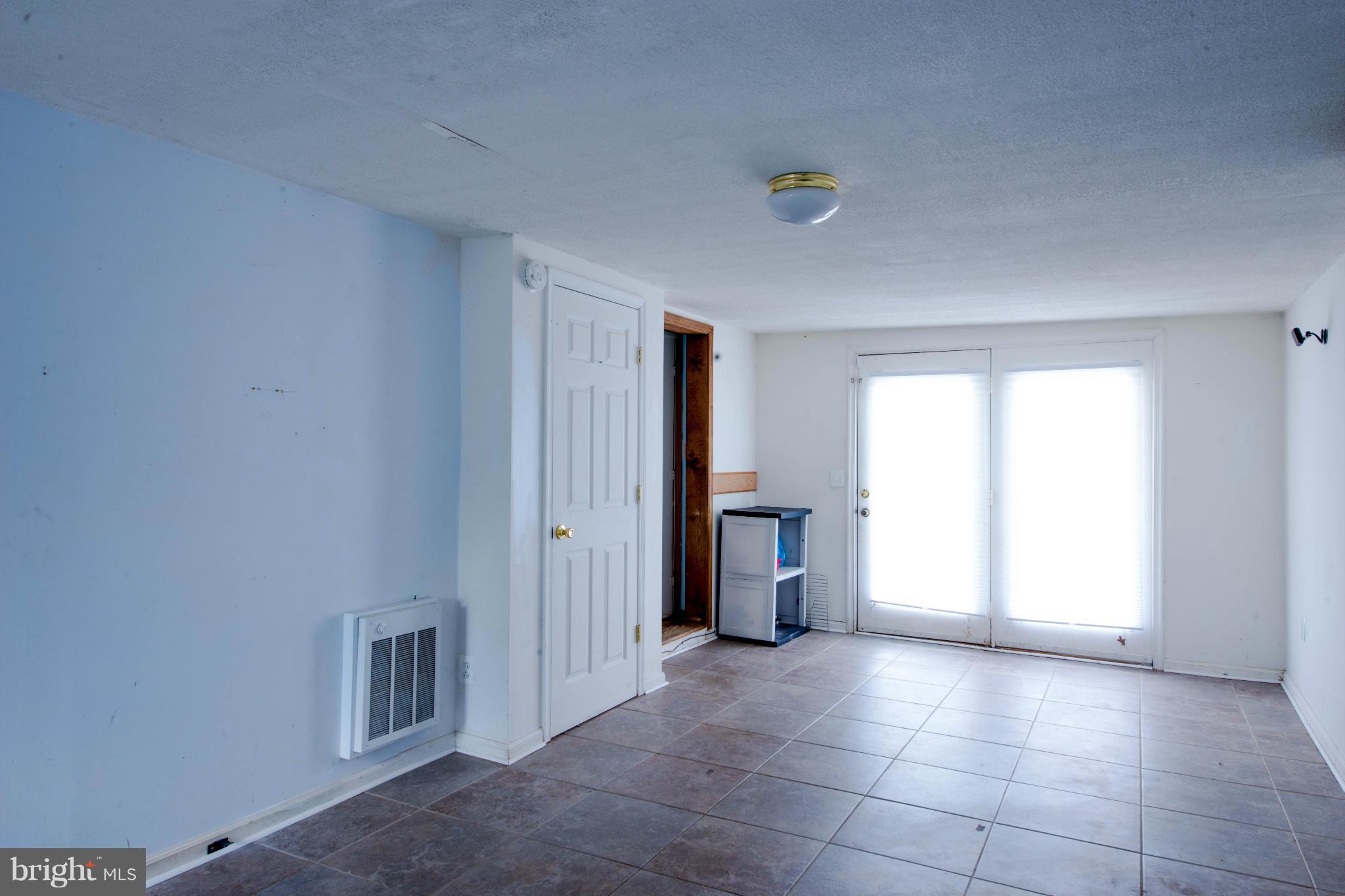 9306 Bethel Road Frederick, MD 21702 - Photo 11 of 19 a view of an empty room with a window