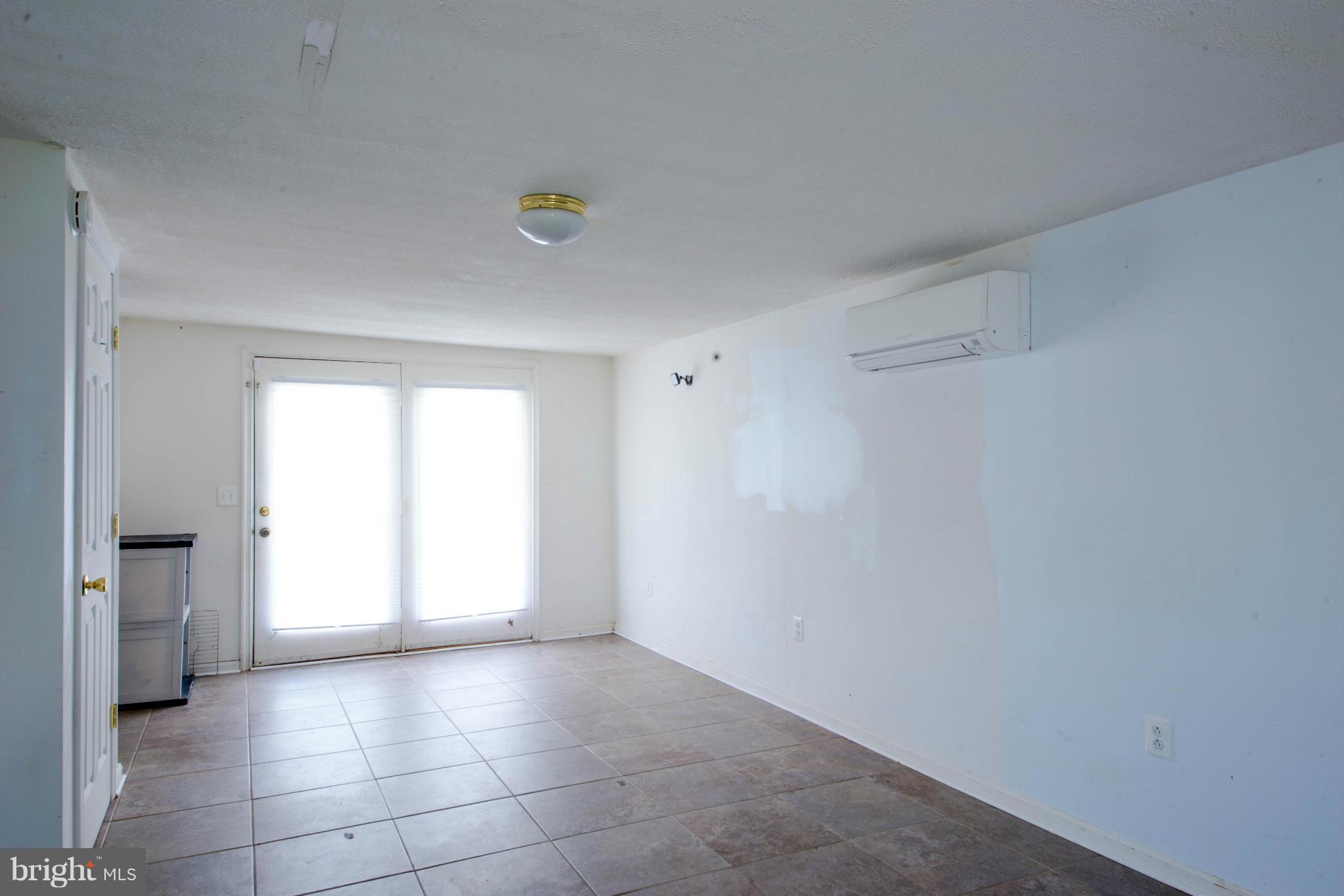 9306 Bethel Road Frederick, MD 21702 - Photo 10 of 19 a view of an empty room with a window