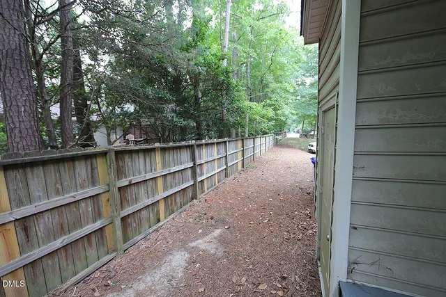 a backyard of a house with lots of green space