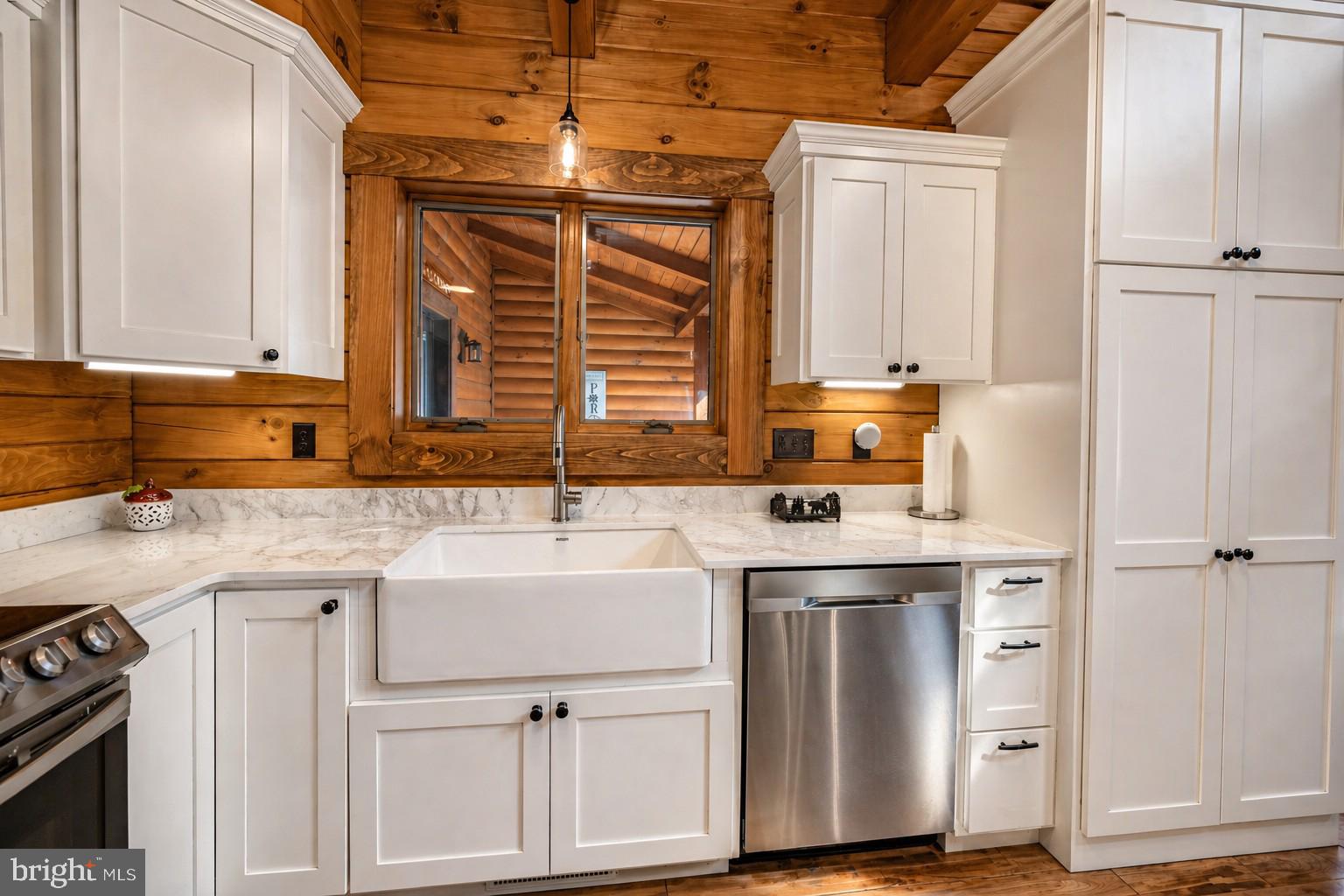 75 Fern Loop Oakland, MD 21550 - Photo 11 of 75 a kitchen with a sink cabinets and window