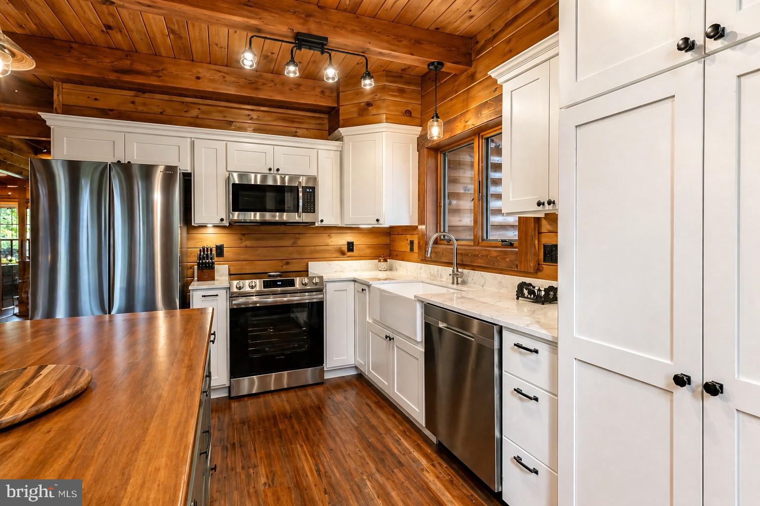 75 Fern Loop Oakland, MD 21550 - Photo 12 of 75 a kitchen with stainless steel appliances granite countertop a stove a sink and a refrigerator