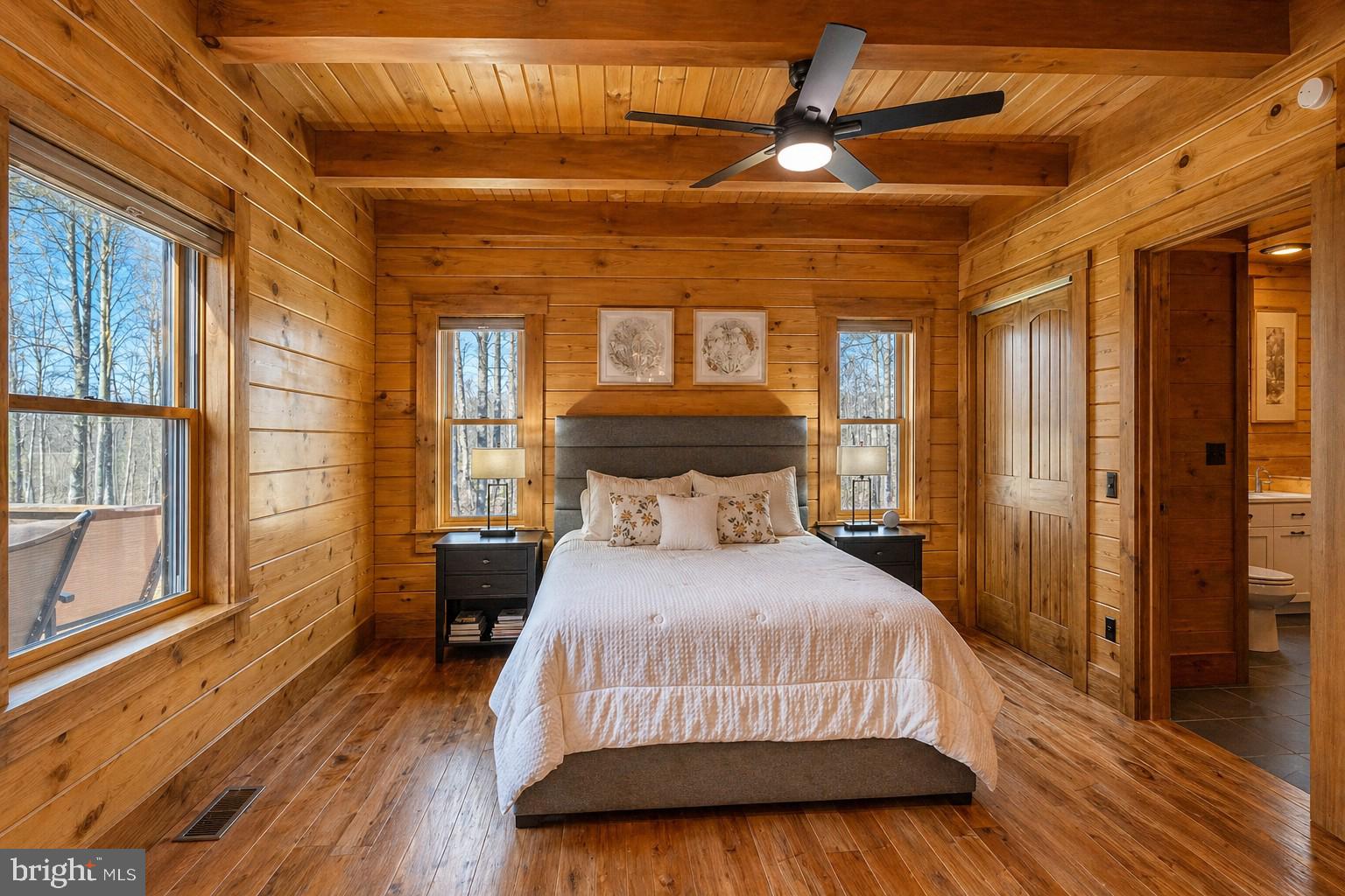 75 Fern Loop Oakland, MD 21550 - Photo 26 of 75 a bedroom with a bed and a large window with wooden floor