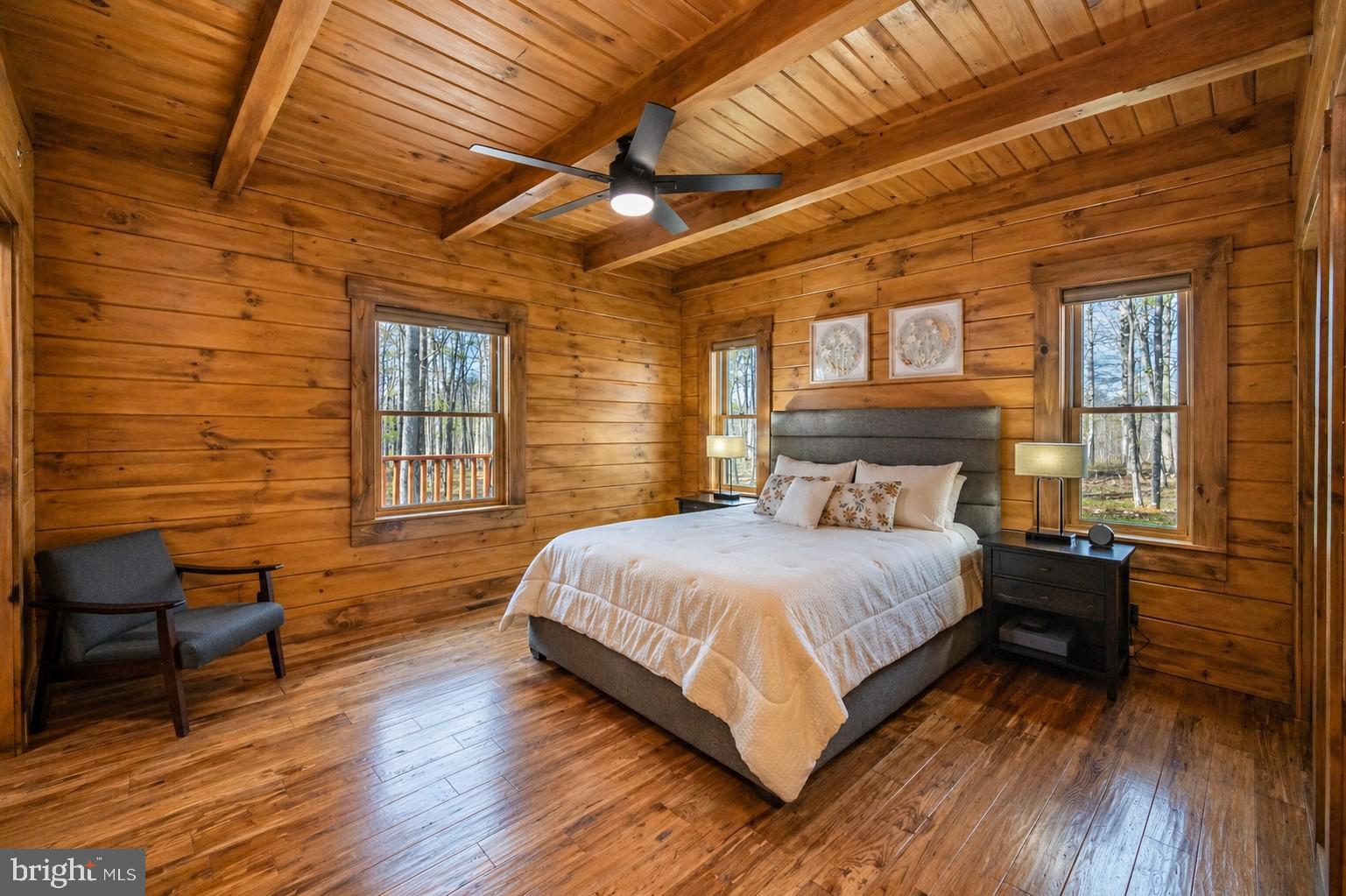 75 Fern Loop Oakland, MD 21550 - Photo 27 of 75 a bedroom with a bed next to a window with wooden floor