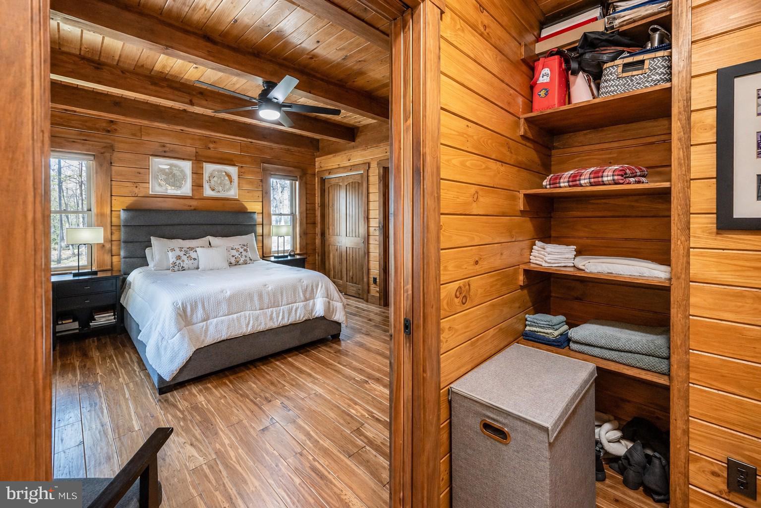 75 Fern Loop Oakland, MD 21550 - Photo 28 of 75 a bedroom with a bed and a night stand
