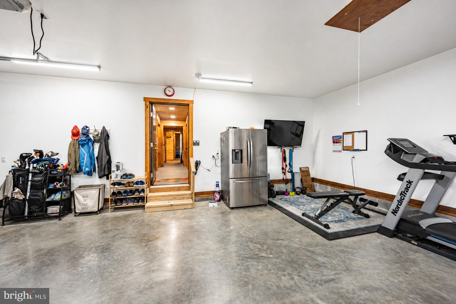 75 Fern Loop Oakland, MD 21550 - Photo 41 of 75 a view of a room with gym equipment