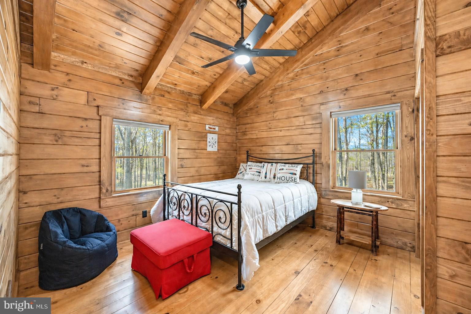 75 Fern Loop Oakland, MD 21550 - Photo 45 of 75 a bedroom with a bed chair and wooden floor