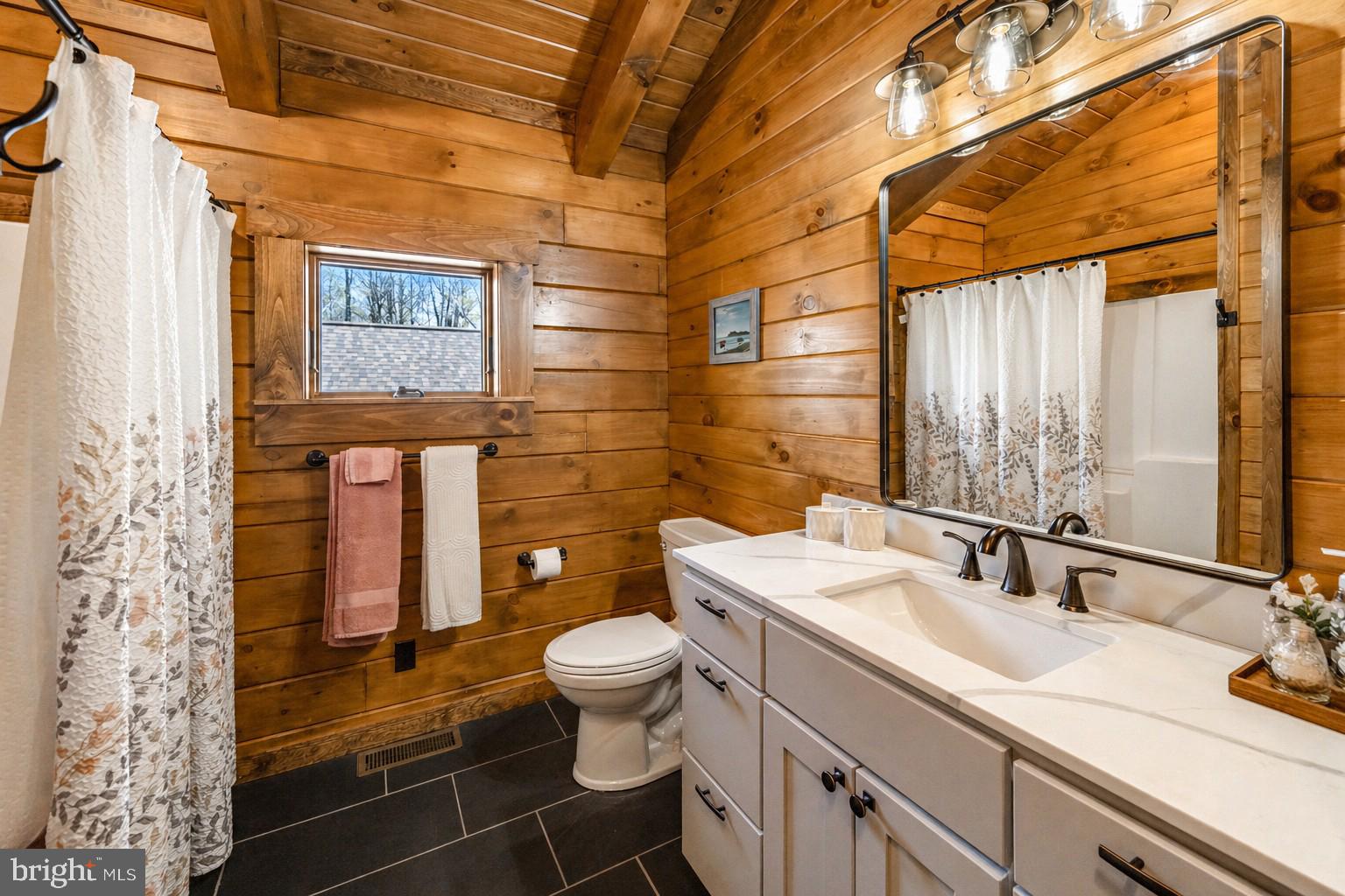 75 Fern Loop Oakland, MD 21550 - Photo 53 of 75 a bathroom with a toilet sink and mirror