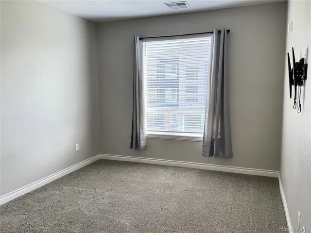 a view of a room that has a window in it