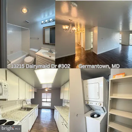 a view of a kitchen with a refrigerator and a sink