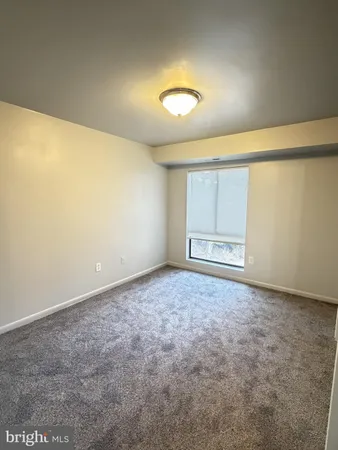 an empty room with a empty space and window