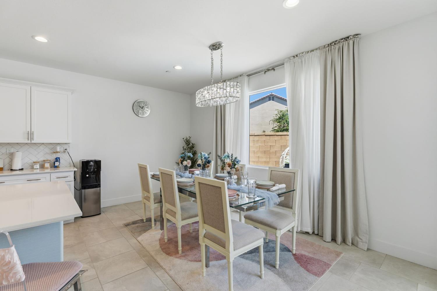 6326 West Richert Avenue Fresno, CA 93723 - Photo 11 of 45 a dining room with furniture a chandelier and window