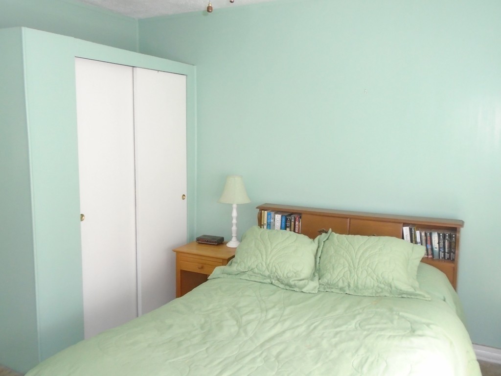 33 Chesterfield Road Worcester, MA 01602 - Photo 15 of 29 a large bed sitting in a bedroom next to a window