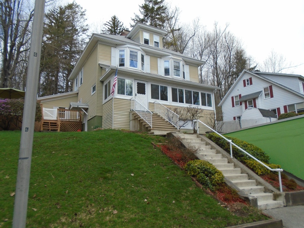 33 Chesterfield Road Worcester, MA 01602 - Photo 2 of 29 a front view of a house with a yard table and chairs