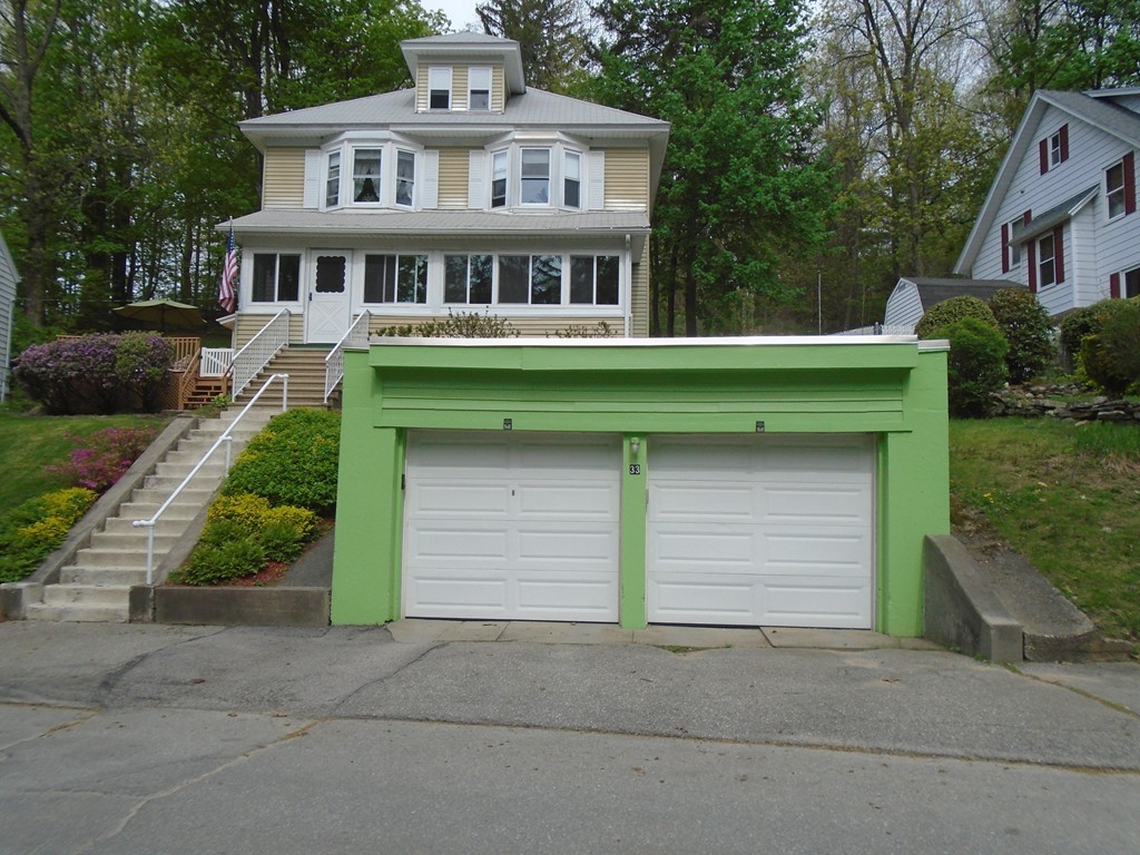 33 Chesterfield Road Worcester, MA 01602 - Photo 3 of 29 a front view of a house with a yard and garage