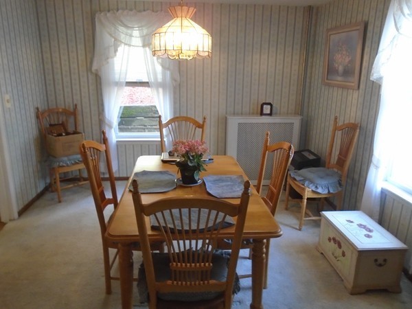33 Chesterfield Road Worcester, MA 01602 - Photo 9 of 29 a view of a dining room with furniture a chandelier and window