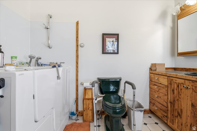 811 East Canyon Road Mayfield, UT 84643 - Photo 22 of 57 Bathroom featuring a walk-in bathtub with integrated shower, wood-finish vanity with a single sink, tiled flooring, and a mirrored medicine cabinet