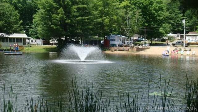 8 S Road, Unit W86 Stafford, CT 06076 - Photo 14 of 20 a view of swimming pool with lawn chairs and plants