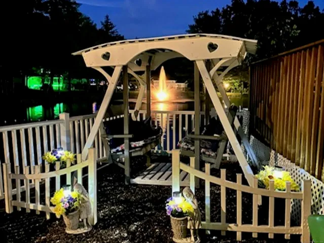 a view of a swimming pool with an outdoor seating