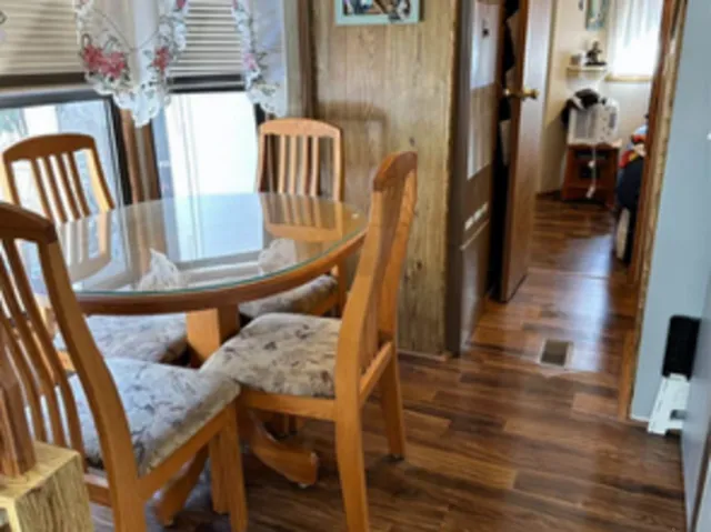 a view of balcony and dining area with furniture