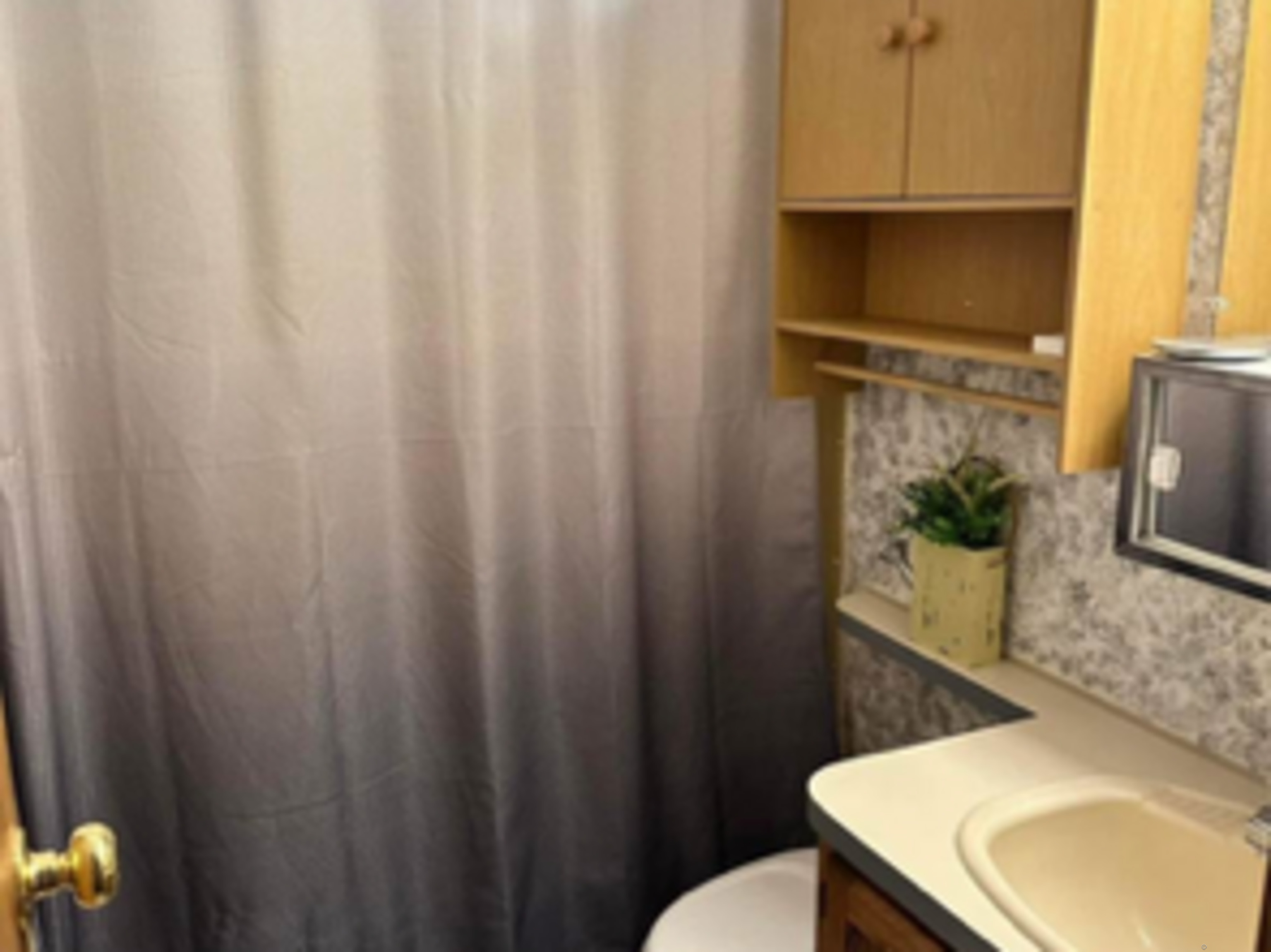 8 S Road, Unit W86 Stafford, CT 06076 - Photo 7 of 20 a bathroom with a sink a toilet and a mirror