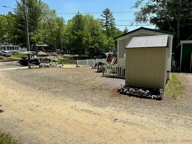 a view of a house with backyard