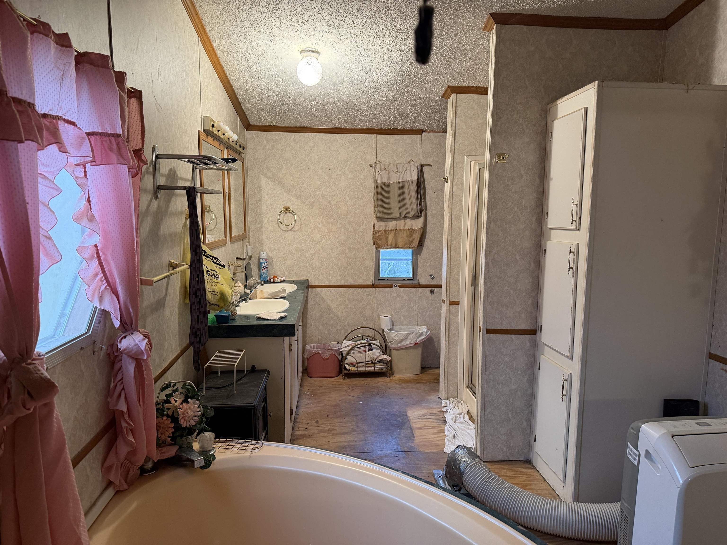 5085 Hardin Graveyard Road Enville, TN 38332 - Photo 12 of 40 a room with furniture a mirror and a wooden floor