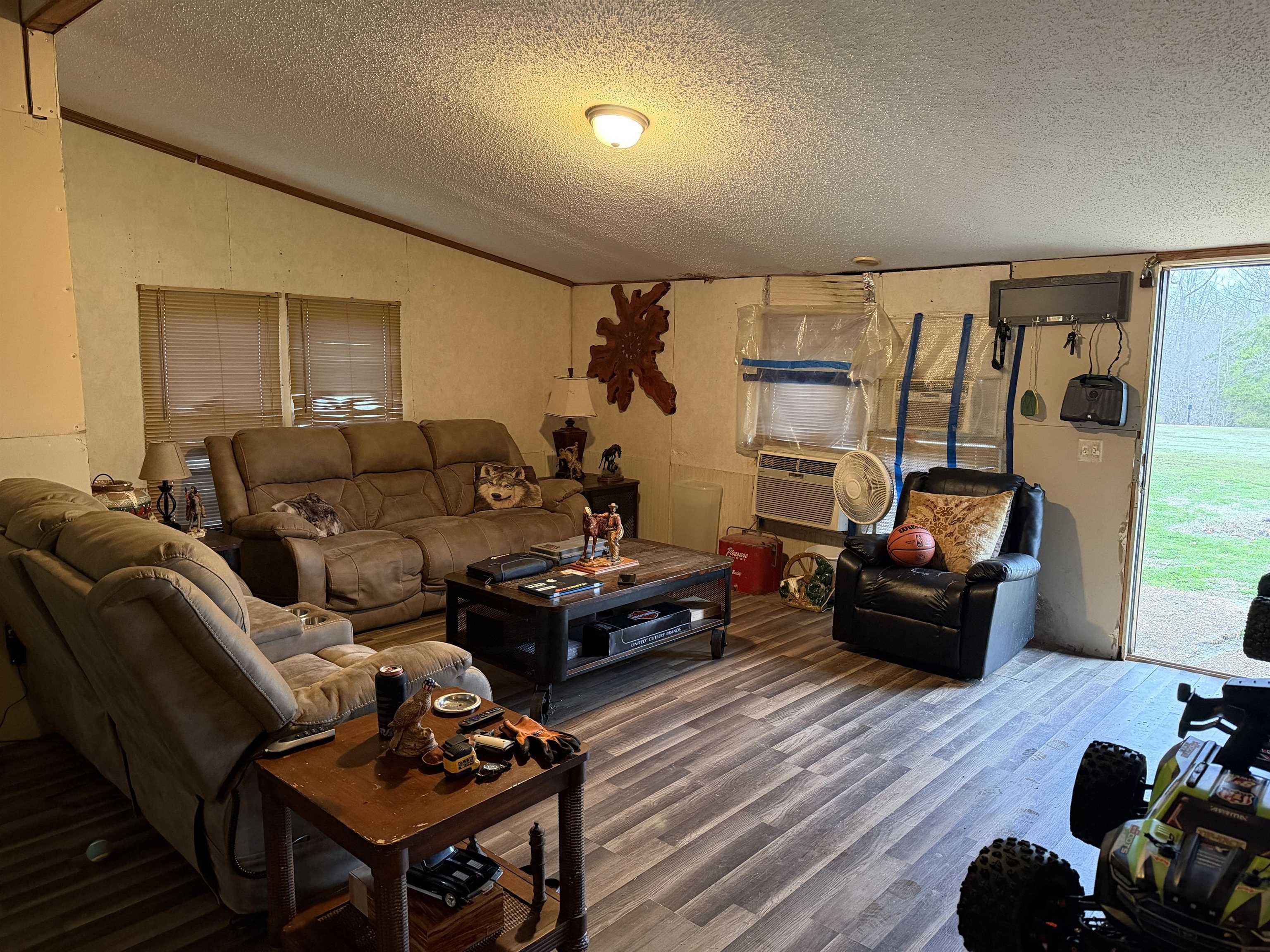 5085 Hardin Graveyard Road Enville, TN 38332 - Photo 24 of 40 a living room with furniture and wooden floor