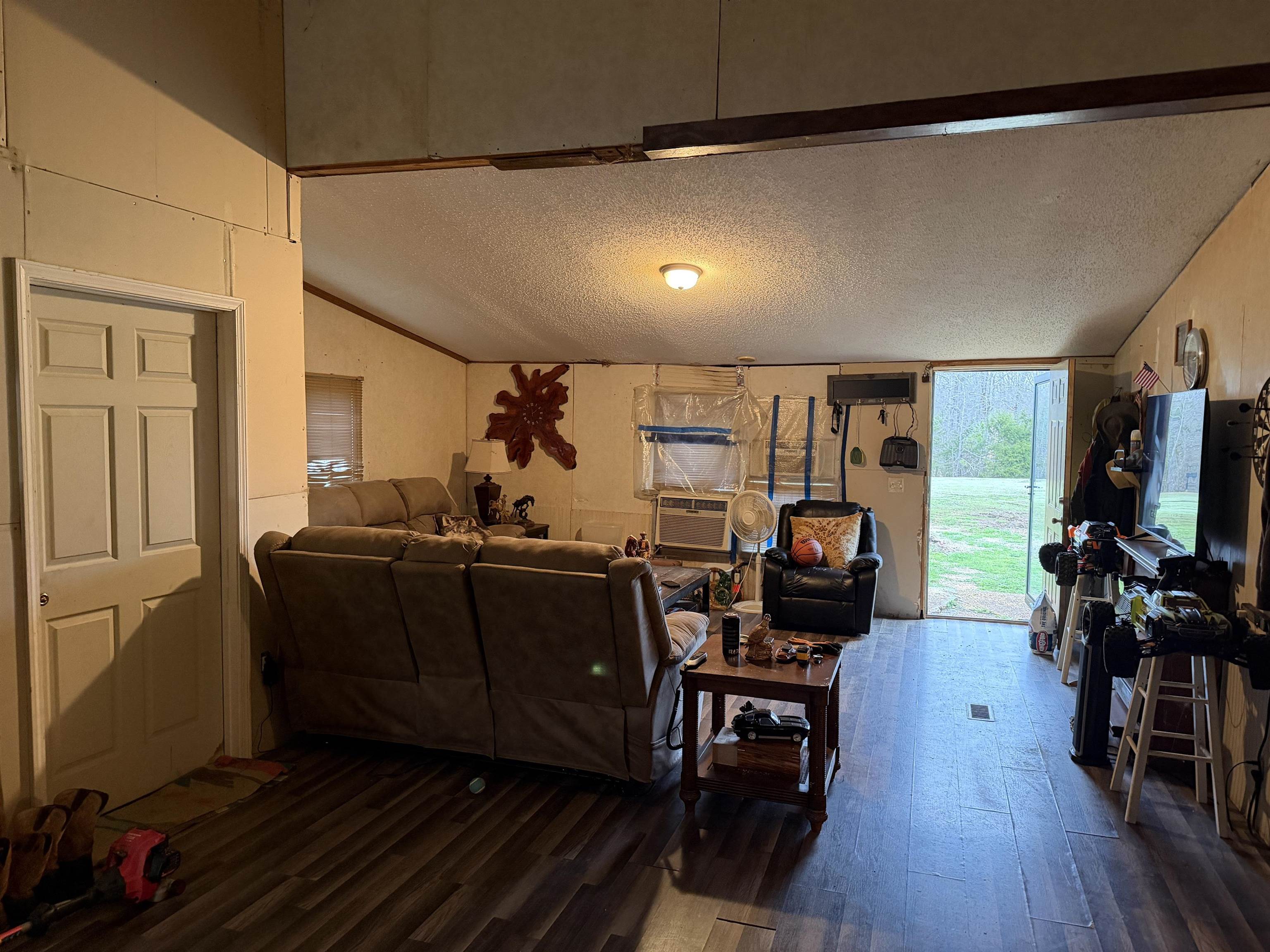 5085 Hardin Graveyard Road Enville, TN 38332 - Photo 26 of 40 a living room with furniture and a flat screen tv