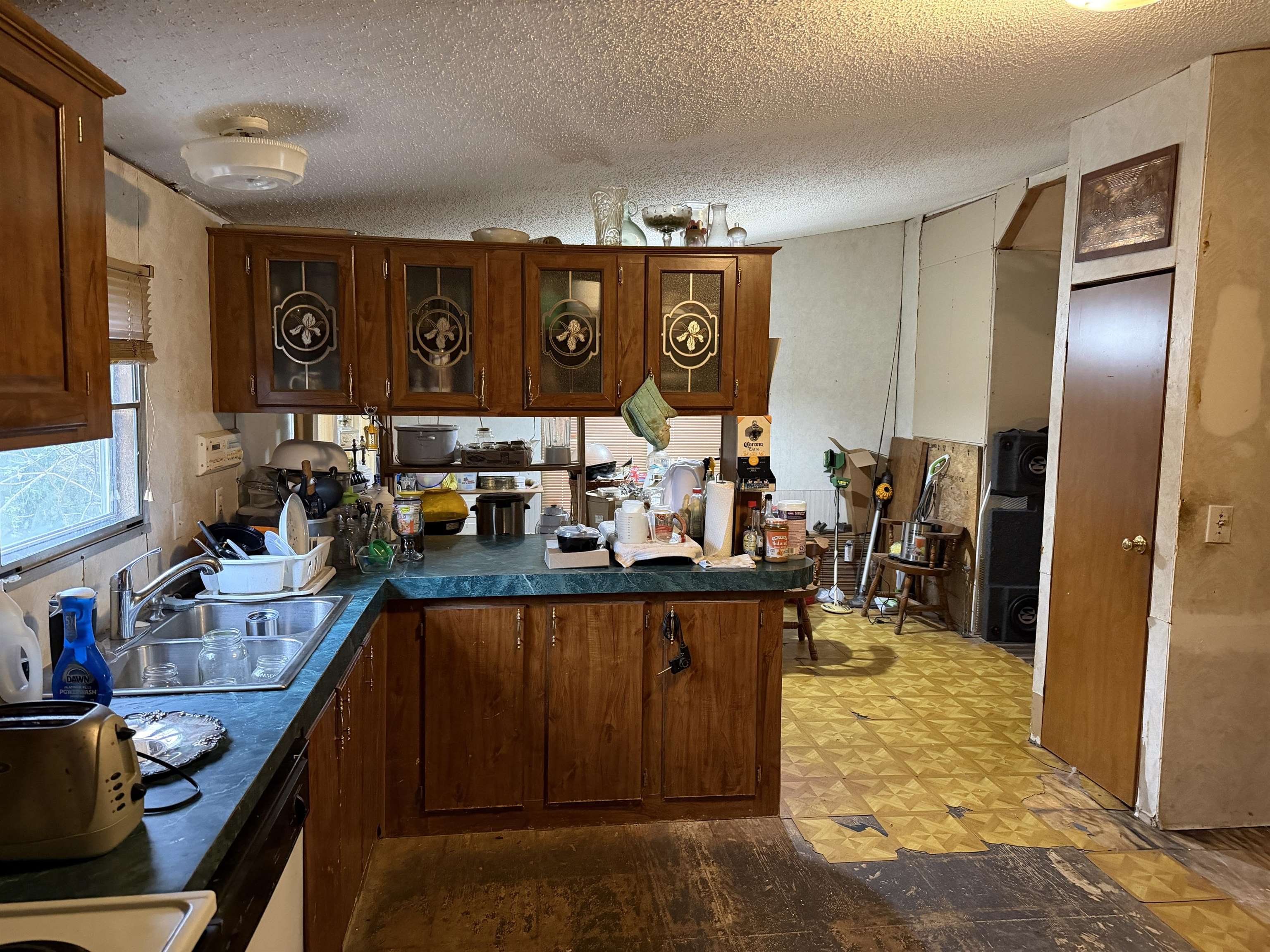 5085 Hardin Graveyard Road Enville, TN 38332 - Photo 27 of 40 a kitchen with stainless steel appliances granite countertop a refrigerator and stove