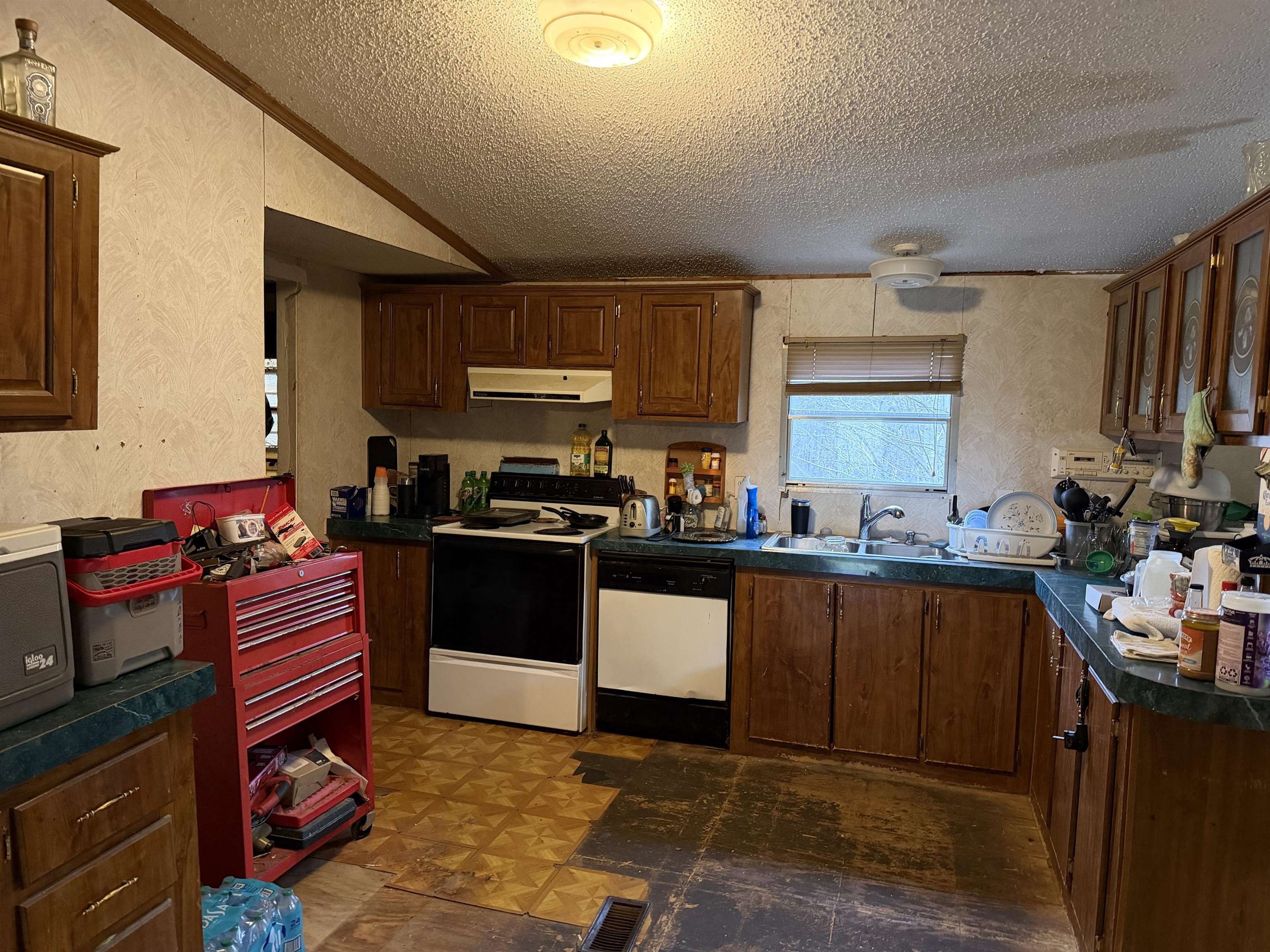 5085 Hardin Graveyard Road Enville, TN 38332 - Photo 28 of 40 a kitchen with stainless steel appliances kitchen island granite countertop a sink dishwasher stove and refrigerator