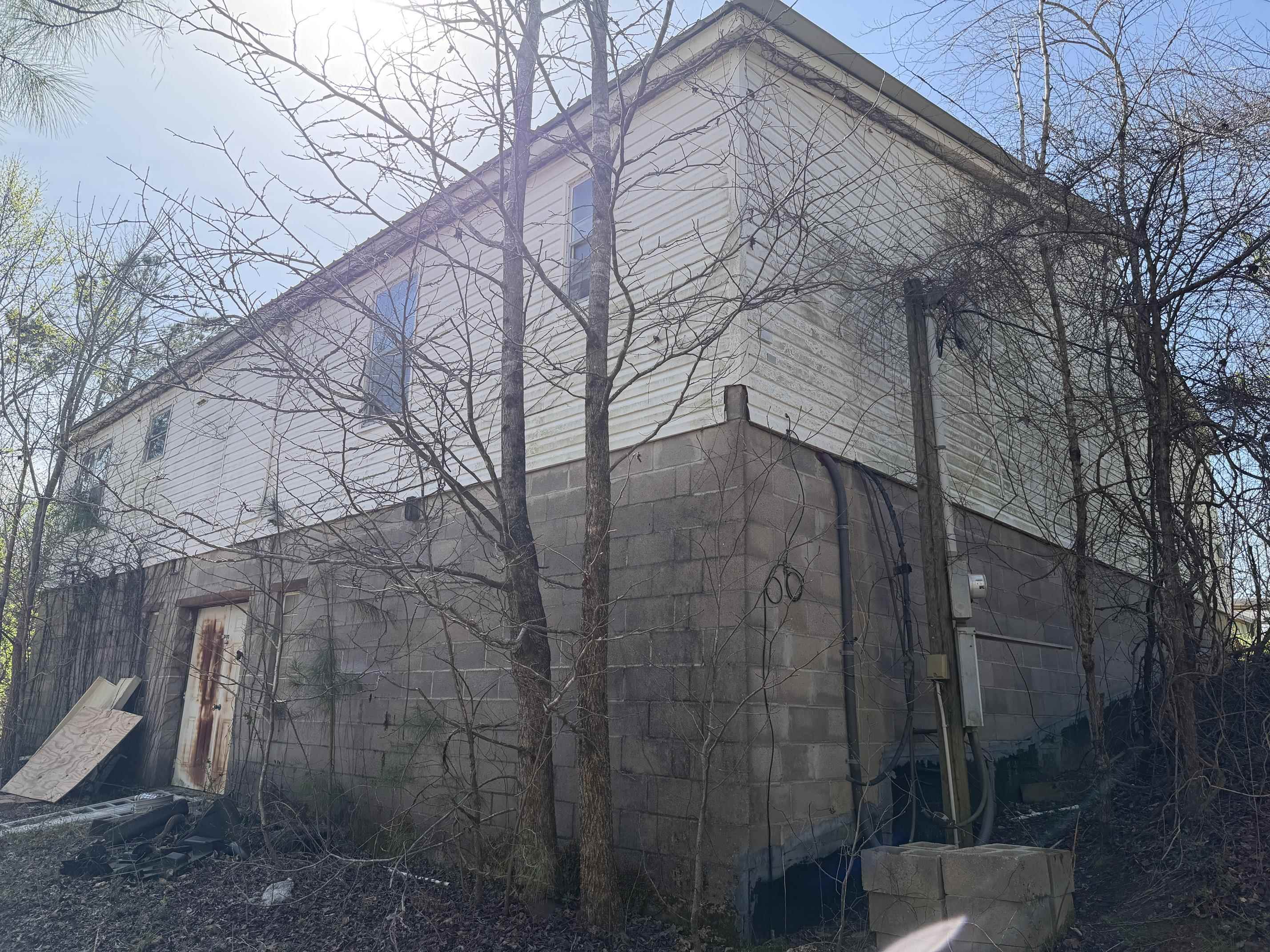 5085 Hardin Graveyard Road Enville, TN 38332 - Photo 37 of 40 a backyard of a house with lots of green space