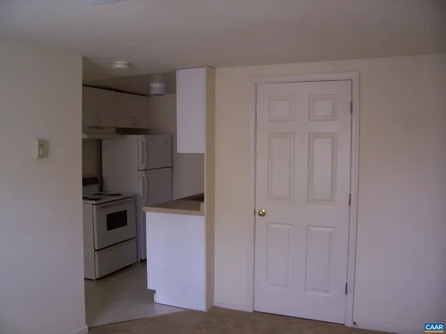 a kitchen with cabinets and stainless steel appliances