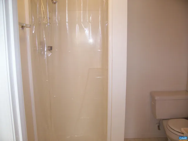 a bathroom with a shower curtain