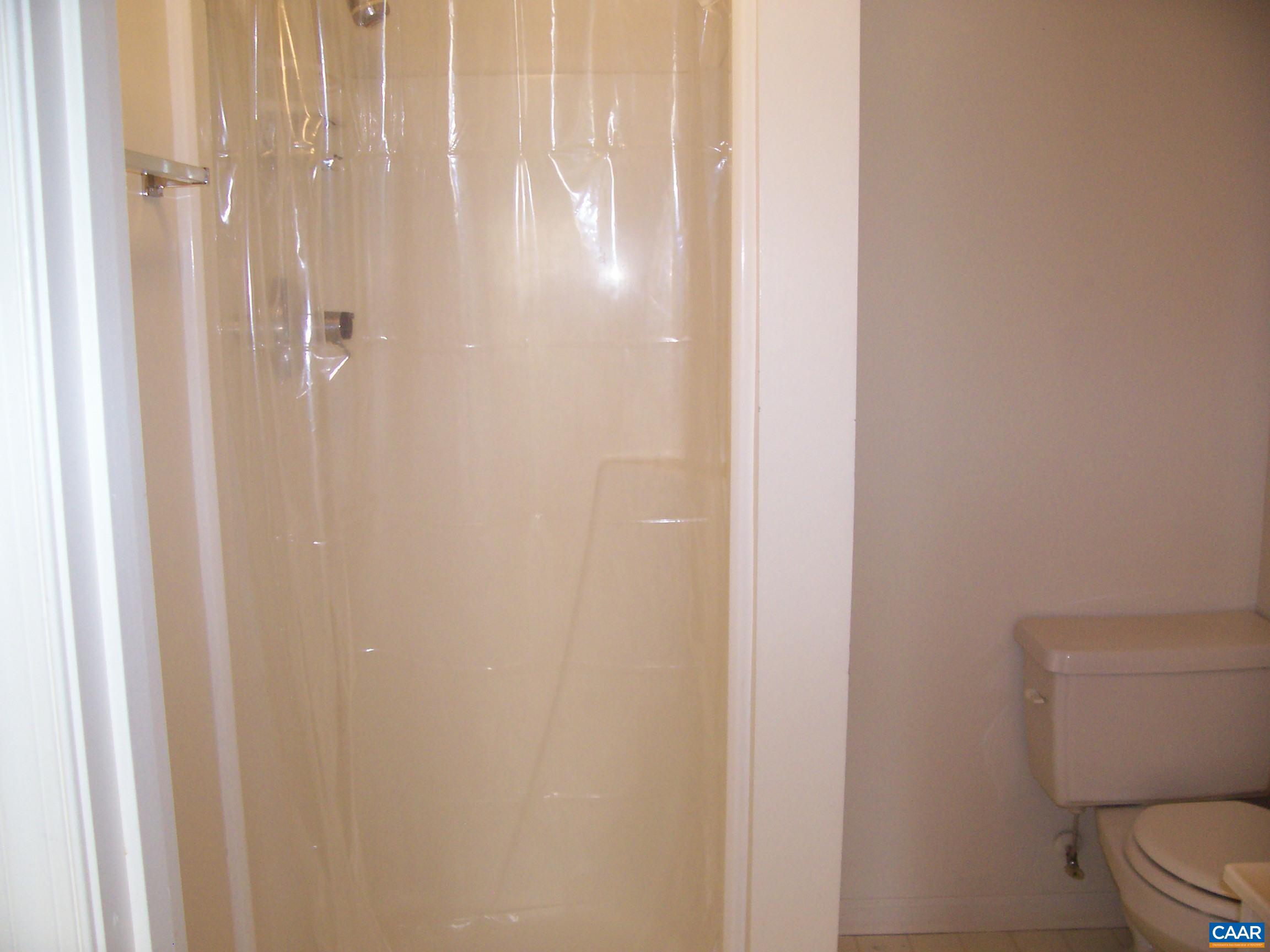 211 Chancellor Street, Unit A Charlottesville, VA 22903 - Photo 8 of 8 a bathroom with a shower curtain