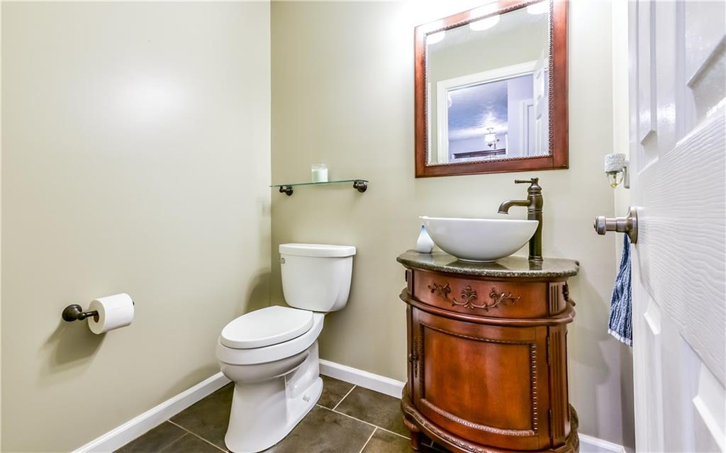 3844 Grove Road Gibsonia, PA 15044 - Photo 11 of 25 Updated half bath with new vanity, sink, faucet, lighting and flooring.