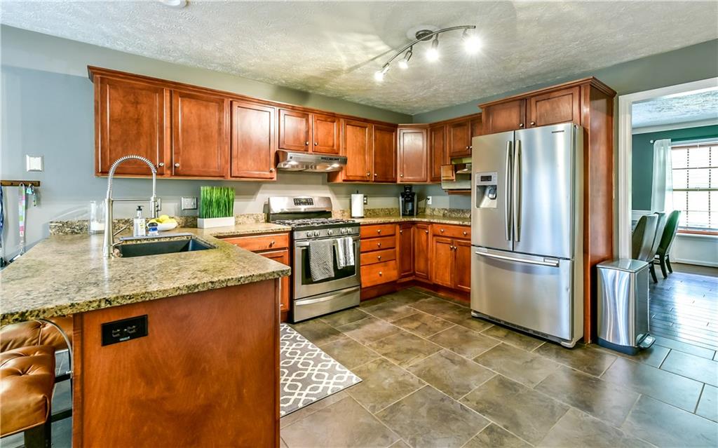 3844 Grove Road Gibsonia, PA 15044 - Photo 15 of 25 Bright, open kitchen with updated kitchen sink, faucet and light fixture.