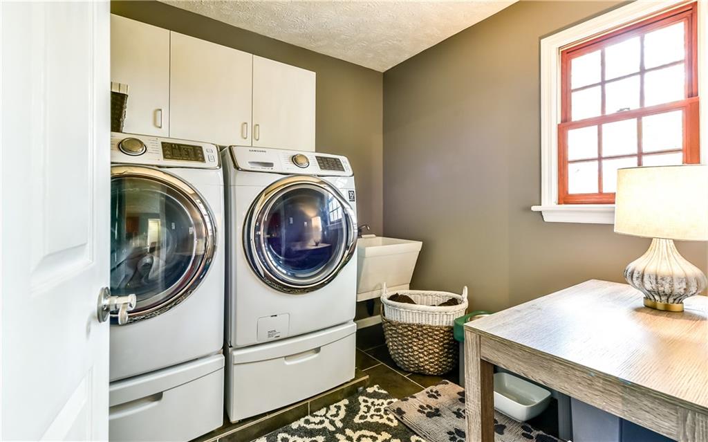3844 Grove Road Gibsonia, PA 15044 - Photo 17 of 25 Separate laundry room off the kitchen, washer and gas dryer included with pedestals.