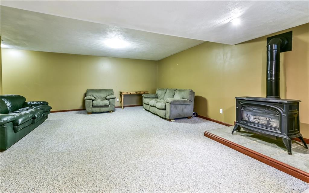 3844 Grove Road Gibsonia, PA 15044 - Photo 24 of 25 Finished walkout basement with wet bar (not shown - behind) and gas stove.