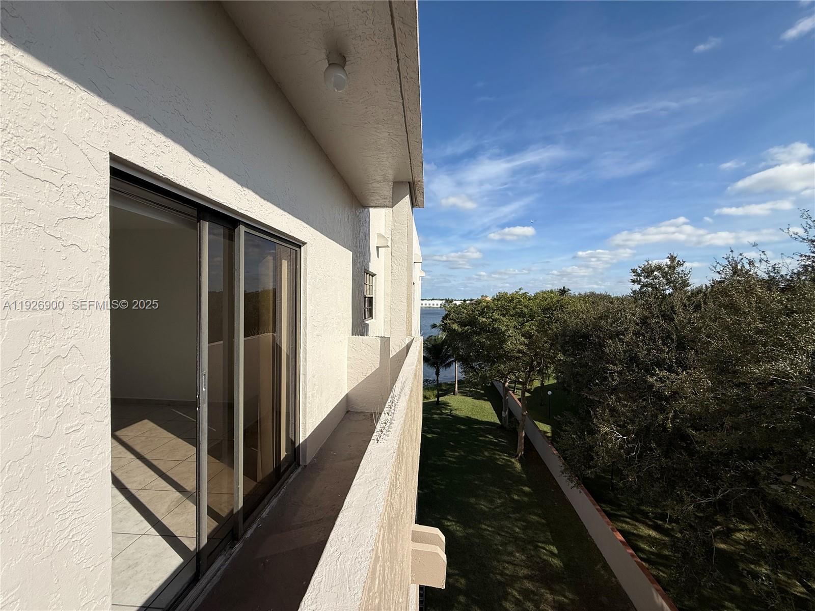 15969 Northwest 64th Avenue, Unit 504 Miami Lakes, FL 33014 - Photo 20 of 21 a view of balcony