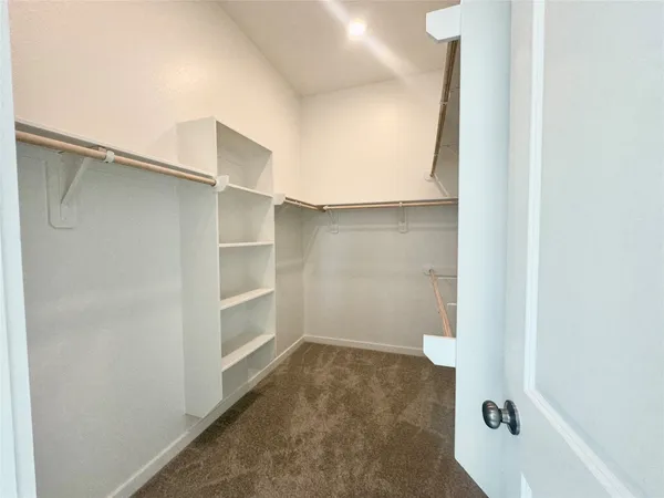a view of an empty walk in closet