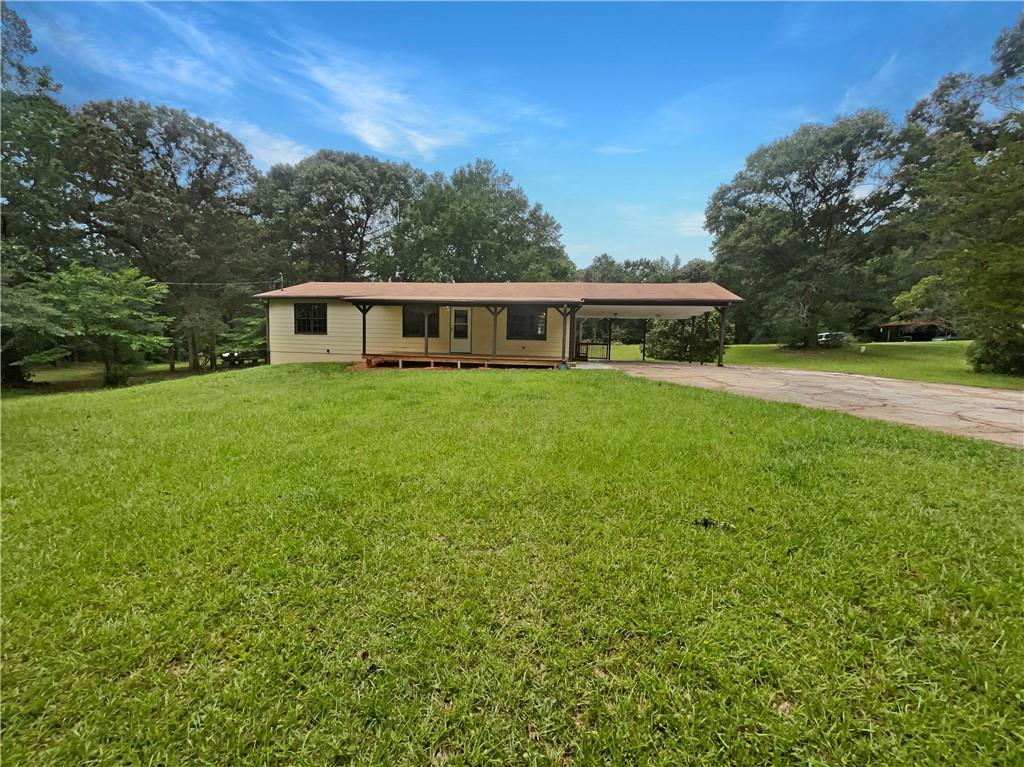 135 County Line Road Ellenwood, GA 30294 - Photo 1 of 1 a front view of a house with a yard