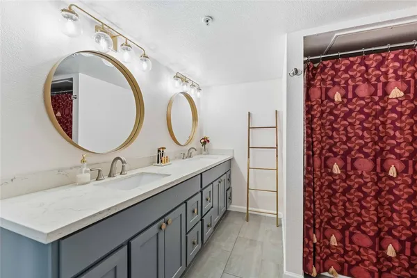 a view of walk in closet with clothes