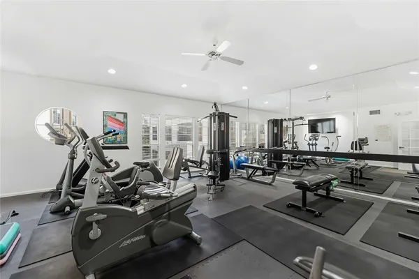 a view of a building with sitting area and garden view