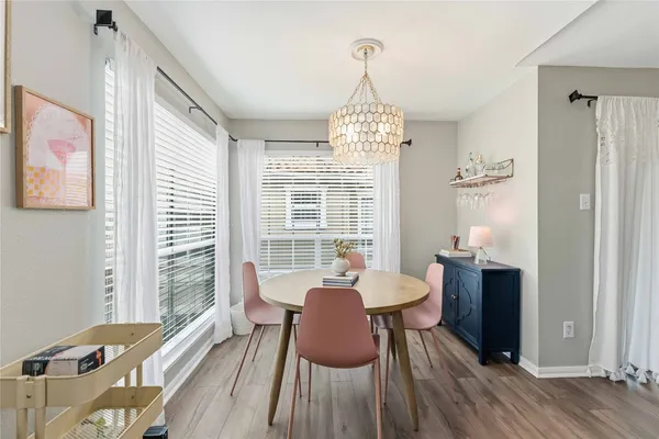 a view of a dining room with furniture window and wooden floor